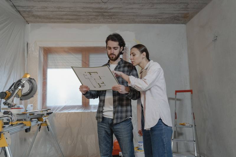 Couple looking over a printed floor plan together