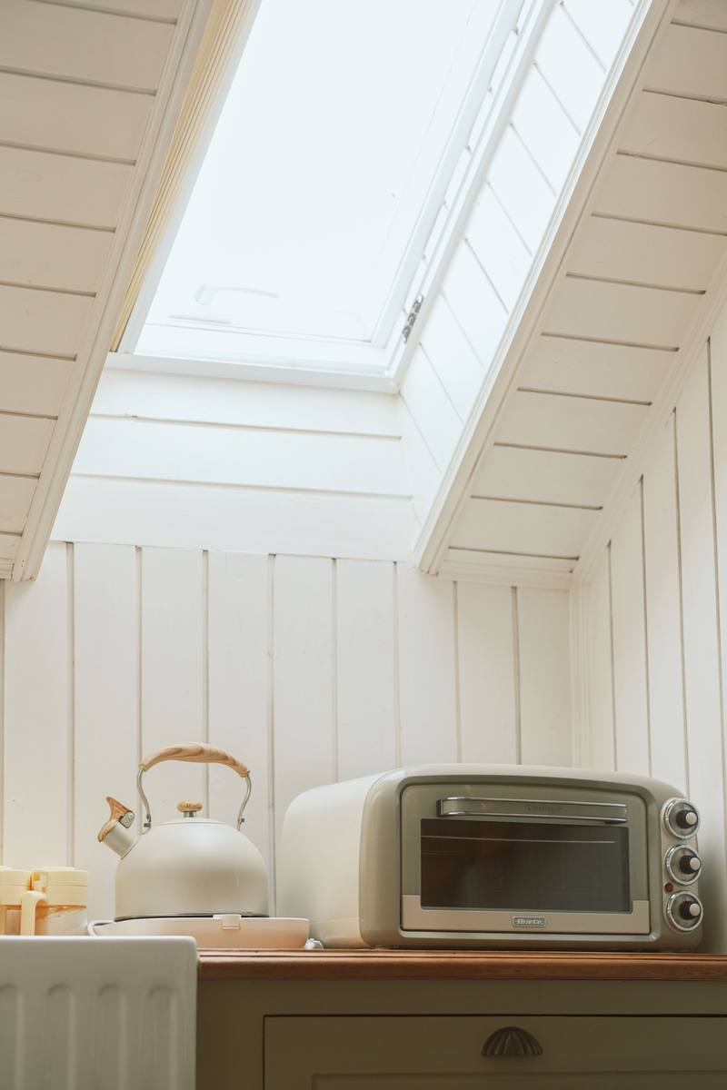 Bright kitchen dining nook lit by a roof light